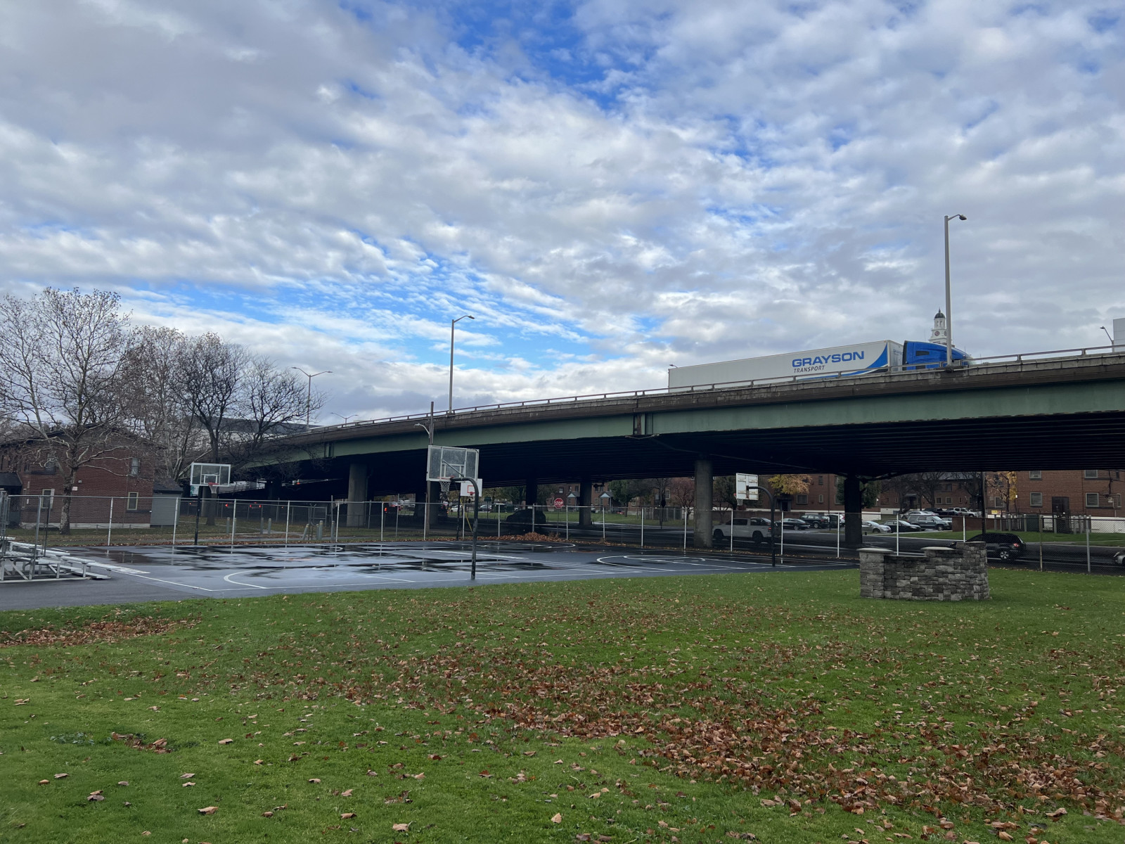 1-81, a raised highway over a basketball court and a small field.